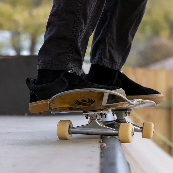A man wearing Splay REV SOS Carlsbad barefoot performance skate shoes during a skate session.