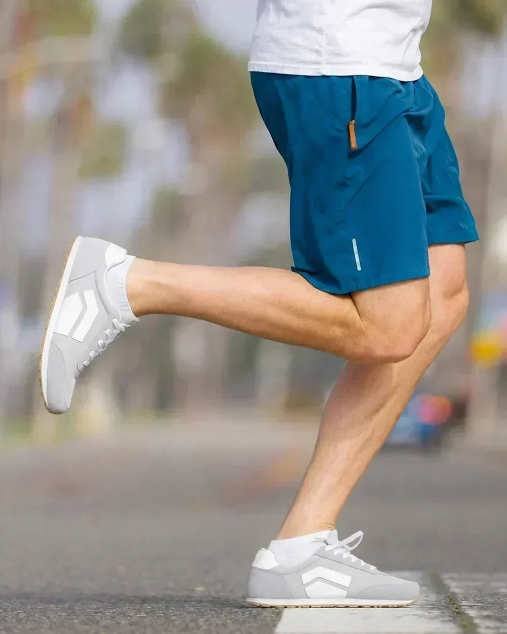 Gray Splay RUNNER V1 running shoes displayed outdoors on pavement.