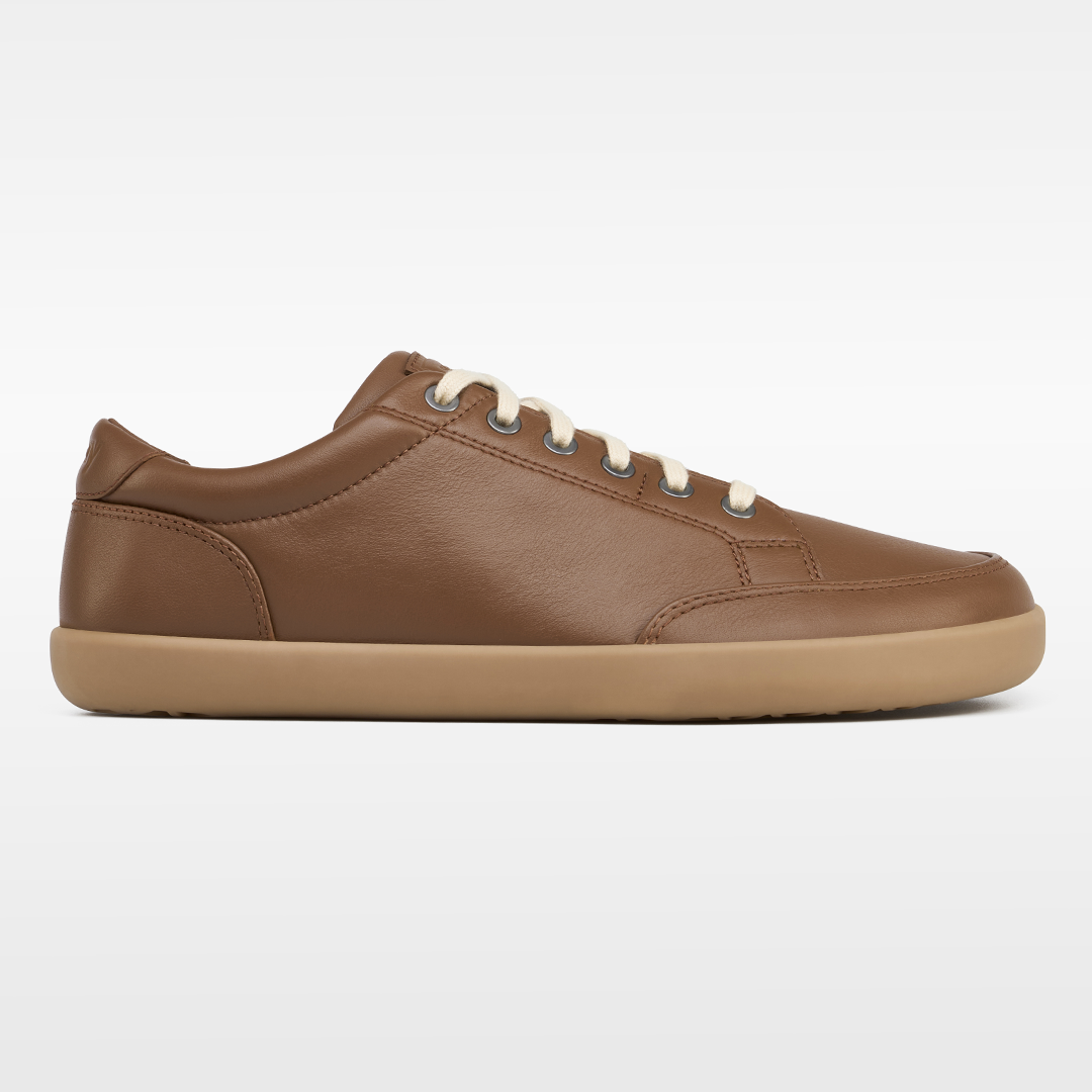 Kids Blue Lagoon barefoot sneaker in bright blue with white sole, designed for natural foot movement.