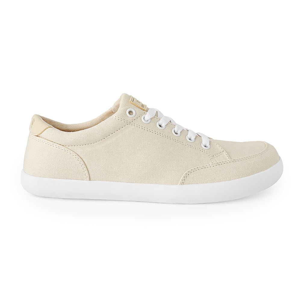 Cream-colored Freestyle2 barefoot sneakers with flexible sole and roomy toe box.