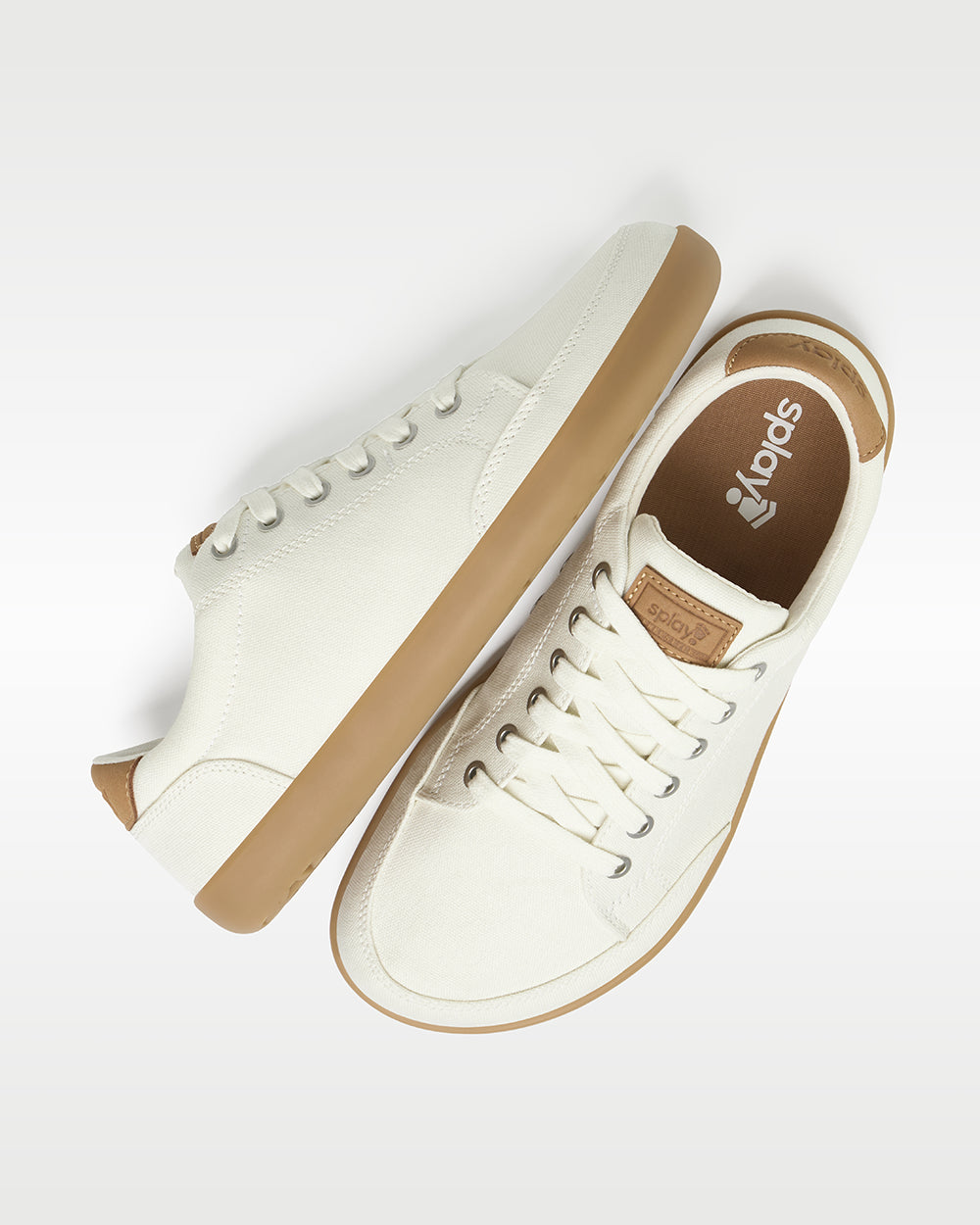 Splay Freestyle Almond barefoot shoes — minimal low-top lace-up sneaker, pair shot from above, one shoe tipped up to show the insole