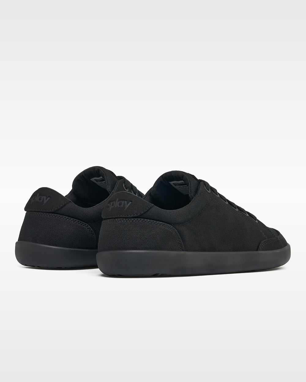 Splay Freestyle Jet barefoot shoes — minimal low-top lace-up sneaker, pair viewed from behind, heels toward the camera