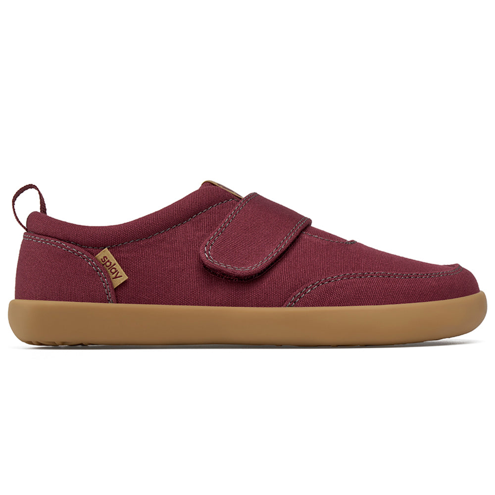 Plum barefoot shoes supporting healthy foot development in kids.