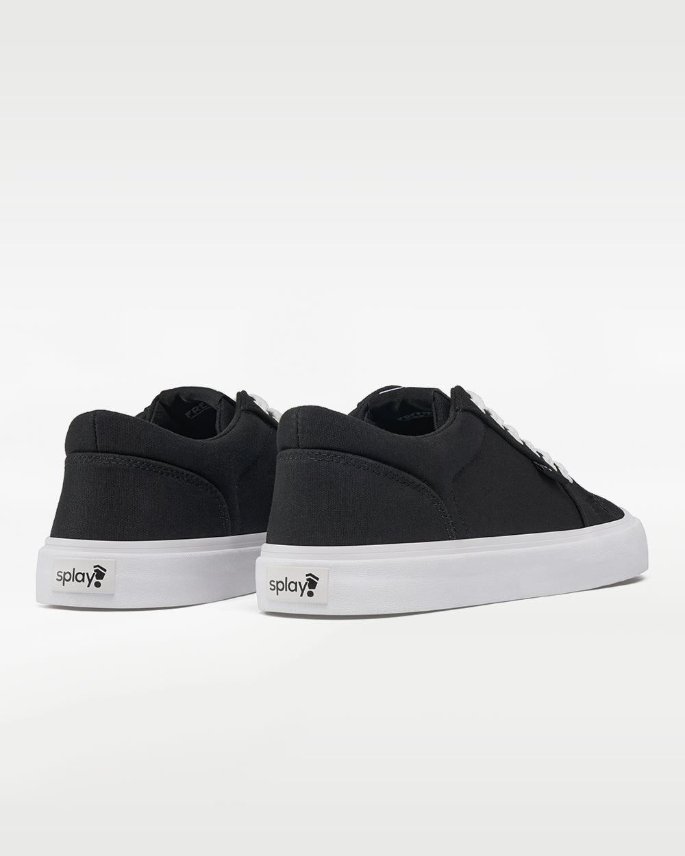 Splay REV LT Canvas Berlin barefoot shoes — low-top skate shoe, pair viewed from behind, heels toward the camera