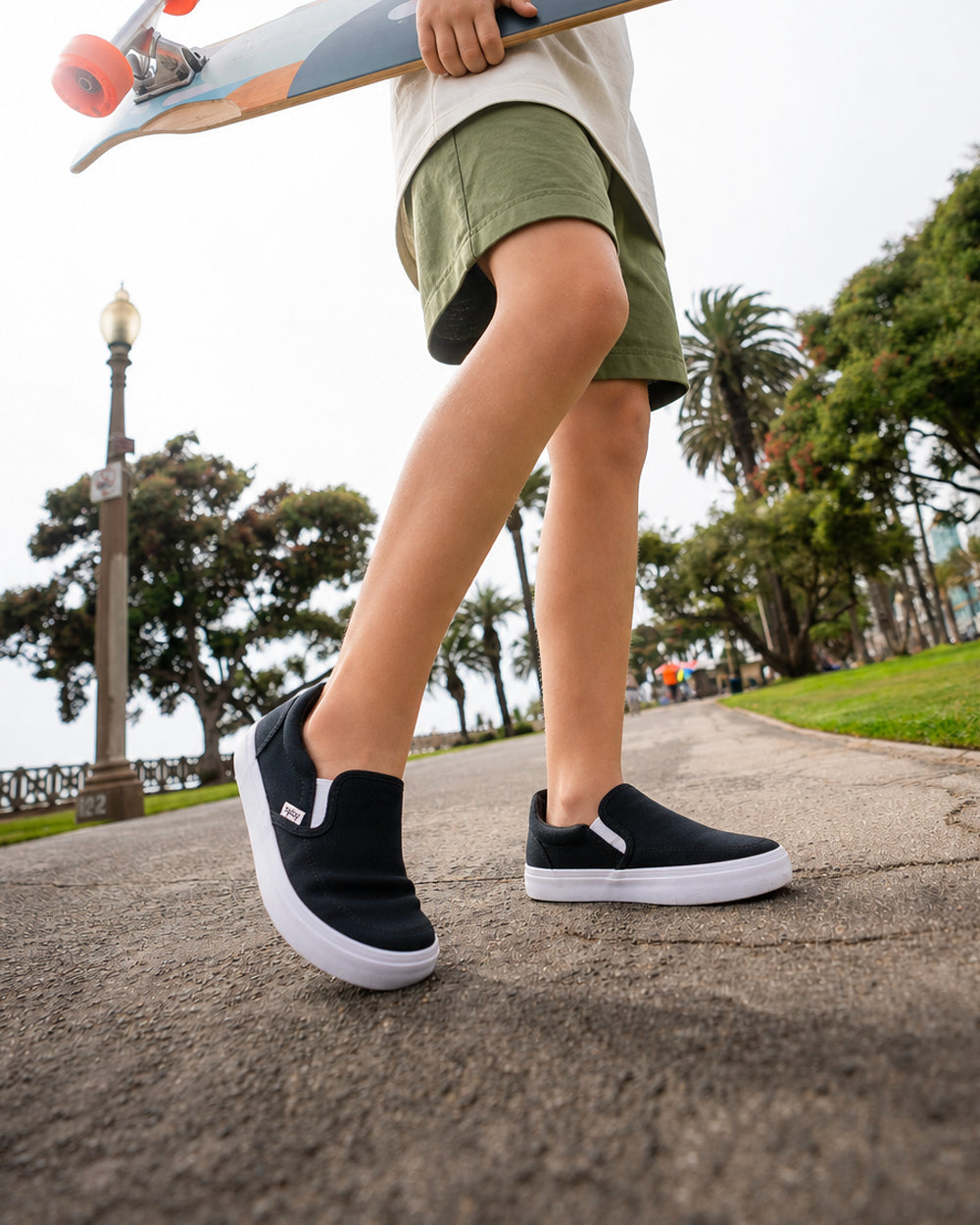 Splay Kids REV SO Berlin barefoot shoes — kids' canvas slip-on, lifestyle photo, the shoes shown in use outdoors