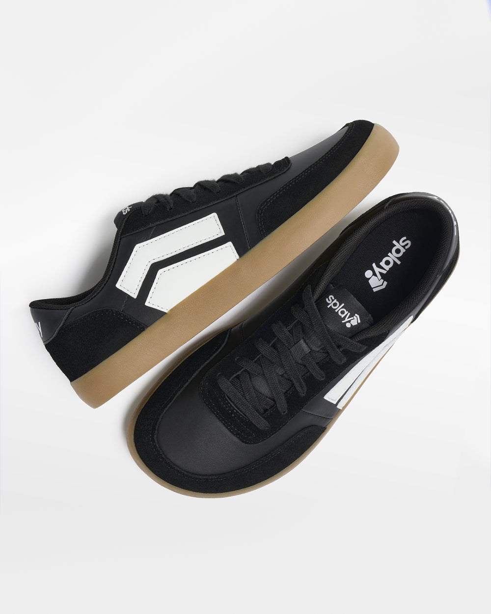 Splay 101 Blackboard '26 barefoot shoes — low-top court sneaker with a side stripe and gum sole, pair shot from above, one shoe tipped up to show the insole