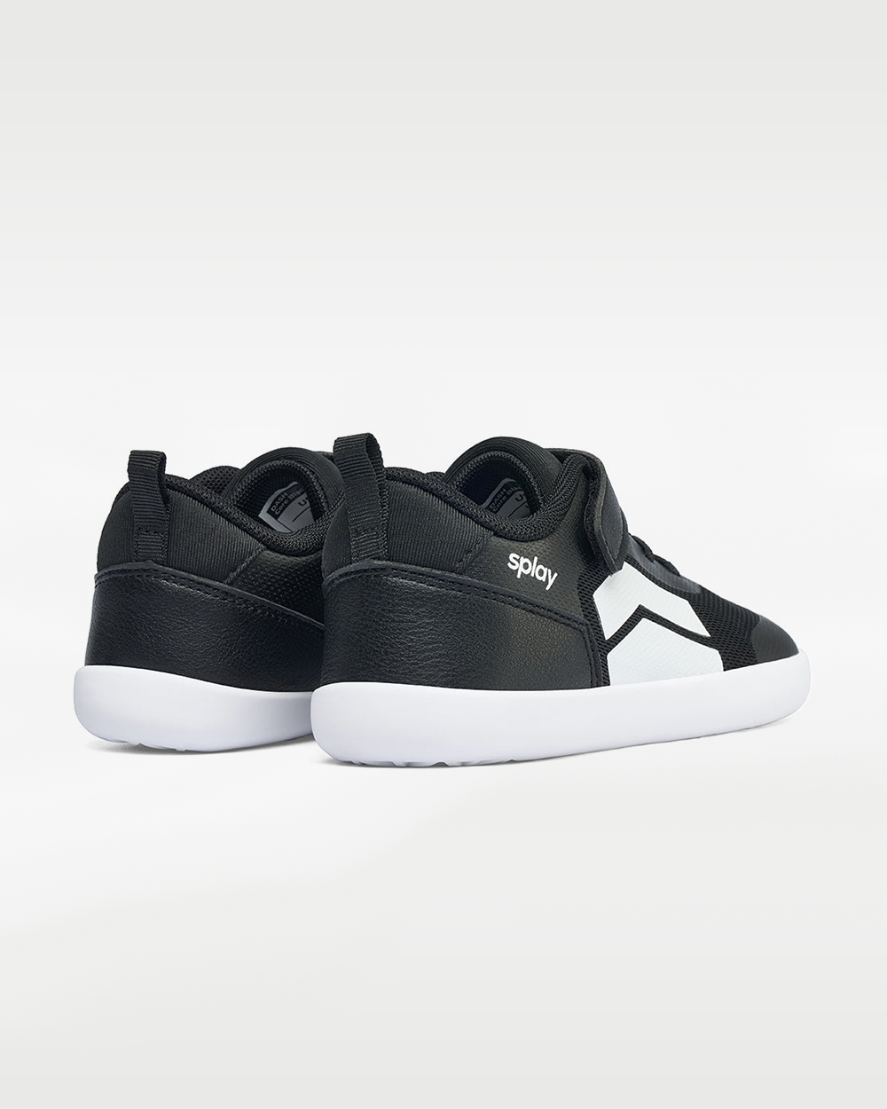 Splay Dash Kids Core Black barefoot shoes — kids' low-top sneaker with a strap and laces, pair viewed from behind, heels toward the camera