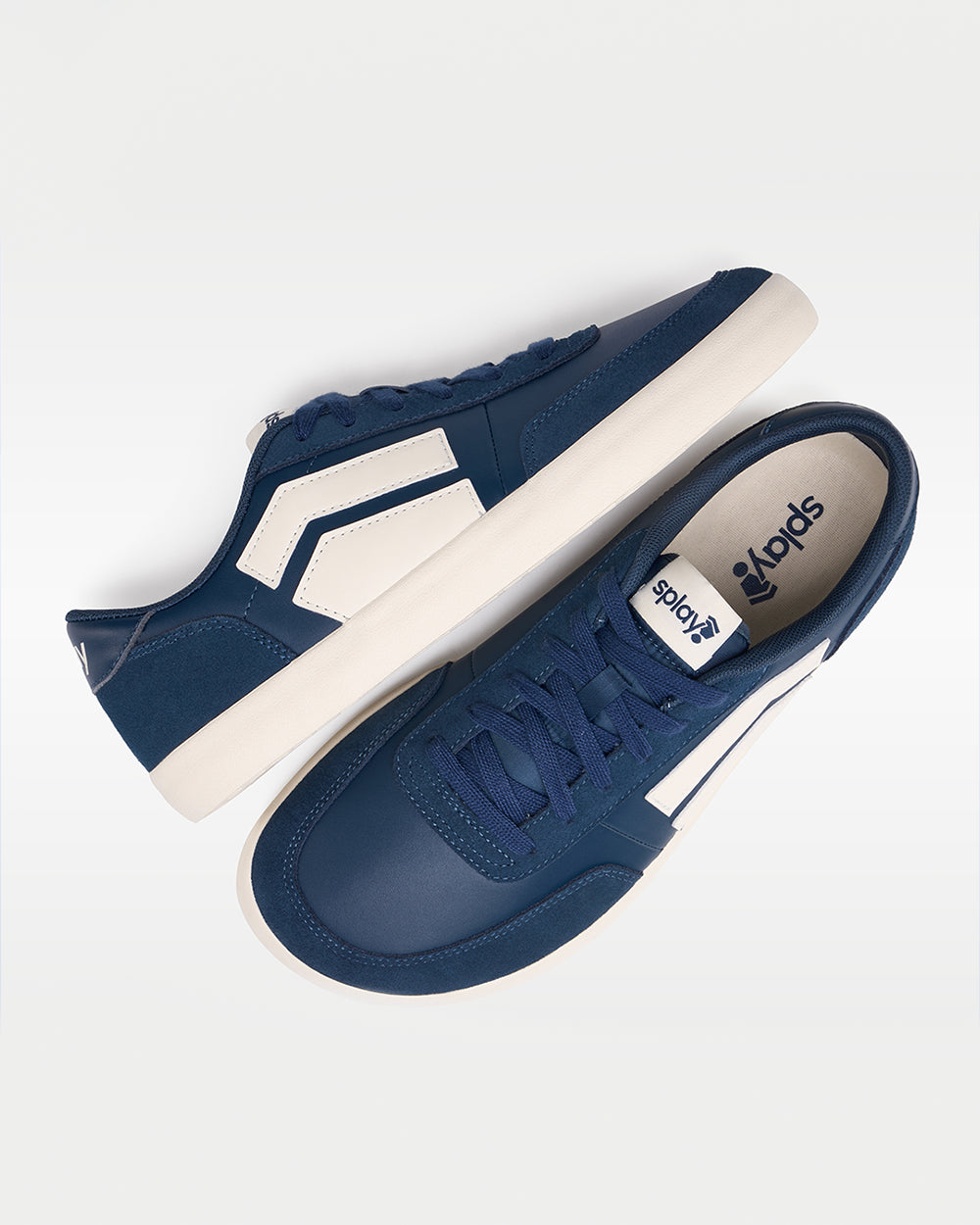 Splay 101 Oxford Blue '26 barefoot shoes — low-top court sneaker with a side stripe and gum sole, pair shot from above, one shoe tipped up to show the insole