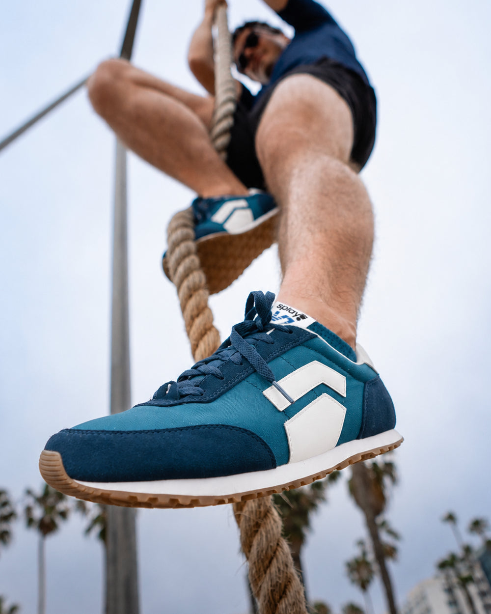 Splay Runner V1 Bleacher Blue '26 barefoot shoes — retro nylon-and-suede running shoe, lifestyle photo, the shoes shown in use outdoors