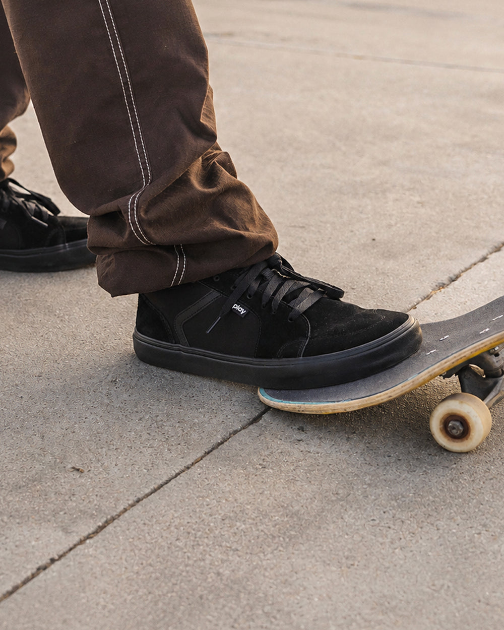 Splay REV LTS Carlsbad barefoot shoes — low-top suede skate shoe, lifestyle photo, the shoes shown in use outdoors