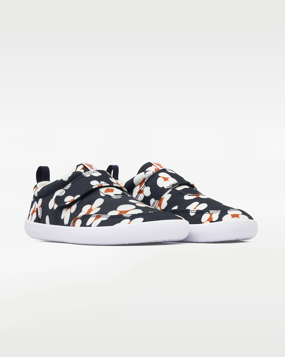 Splay Explore Kids Daisy barefoot shoes — kids' low-top shoe with a hook-and-loop strap, pair in an angled three-quarter view from the front