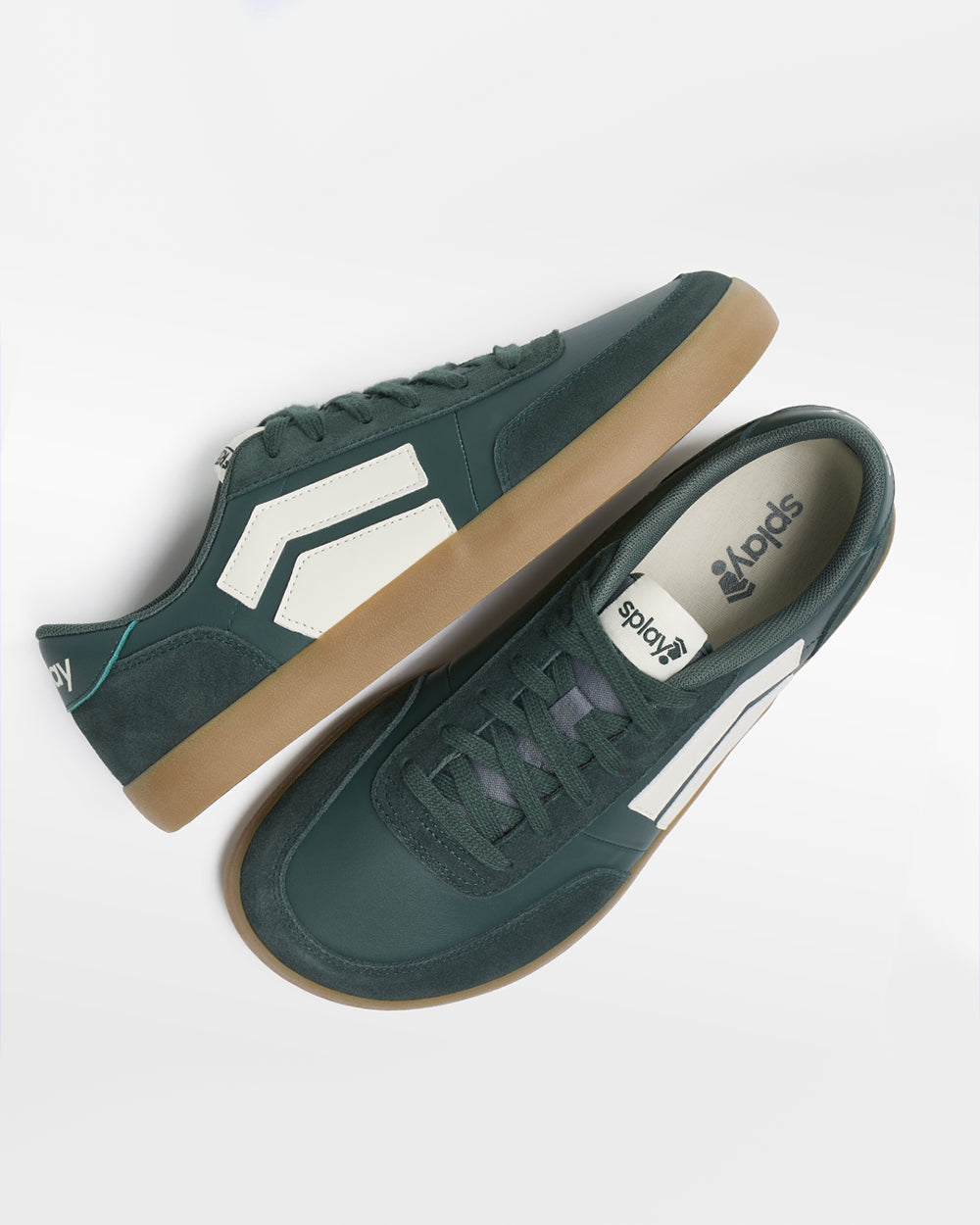 Splay 101 Ivy League Green '26 barefoot shoes — low-top court sneaker with a side stripe and gum sole, pair shot from above, one shoe tipped up to show the insole
