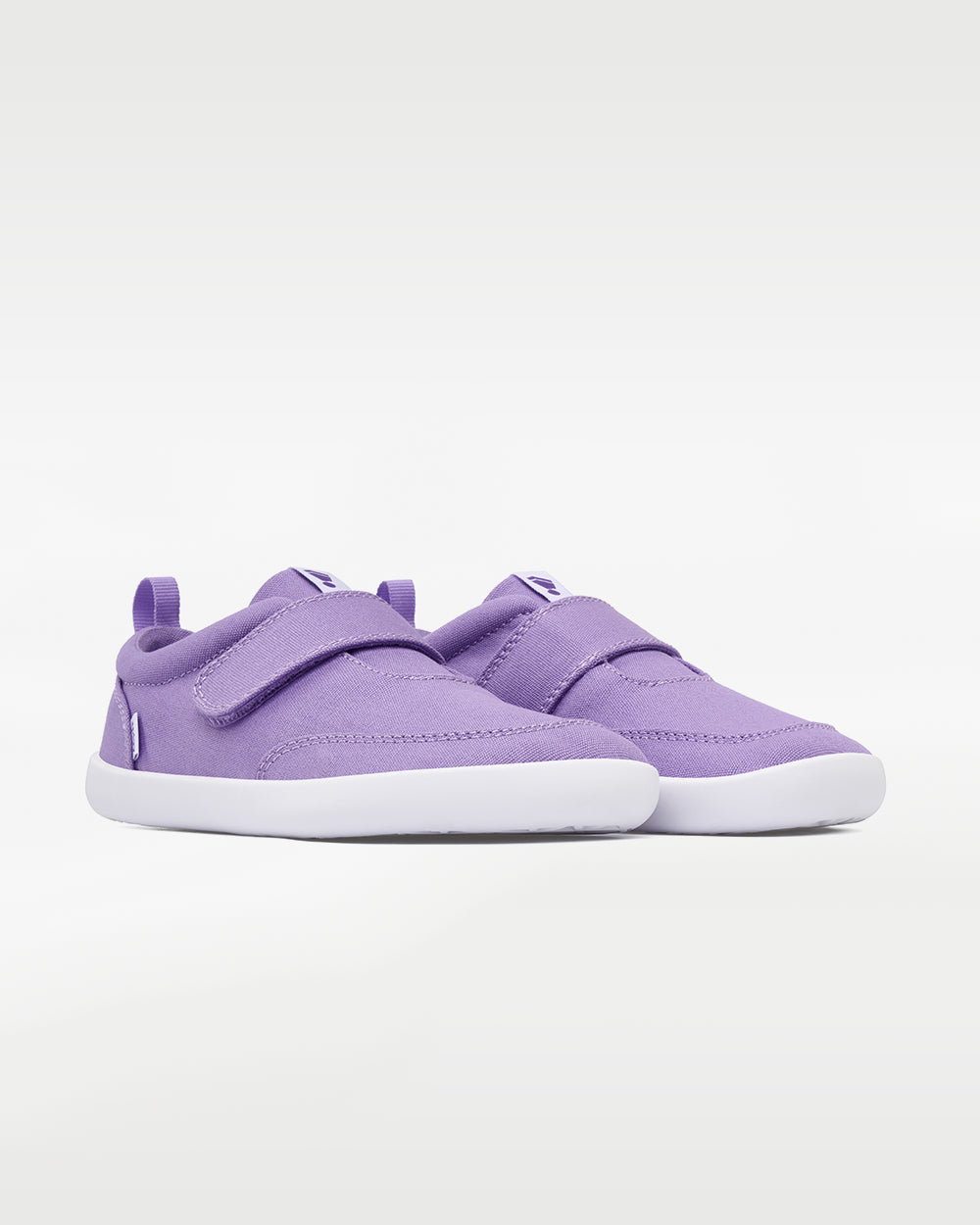 Splay Explore Kids Lavender barefoot shoes — kids' low-top shoe with a hook-and-loop strap, pair in an angled three-quarter view from the front