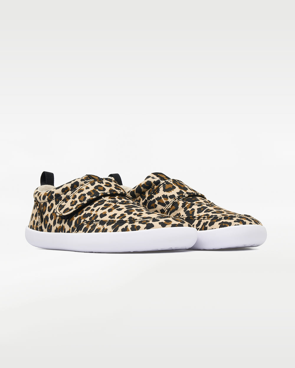 Splay Explore Kids Leopard barefoot shoes — kids' low-top shoe with a hook-and-loop strap, pair in an angled three-quarter view from the front
