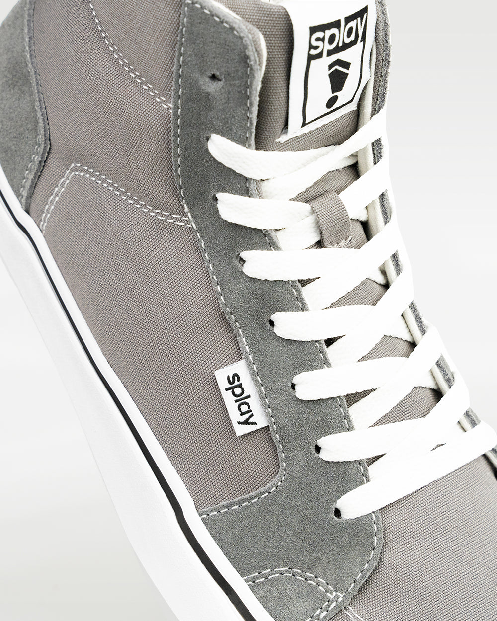 Splay REV HT Original London barefoot shoes — high-top skate shoe, close-up detail of the upper, laces and logo tab