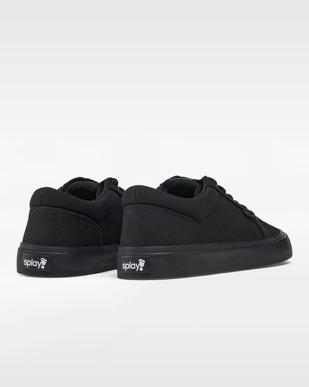 Splay REV LT Canvas New York barefoot shoes — low-top skate shoe, pair viewed from behind, heels toward the camera