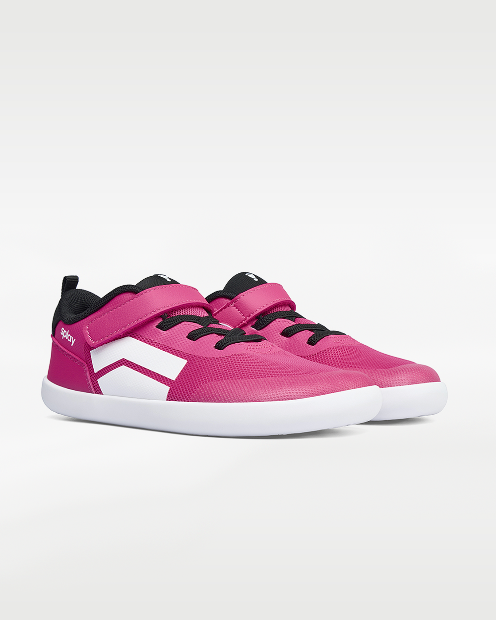 Splay Dash Kids Shock Pink barefoot shoes — kids' low-top sneaker with a strap and laces, pair in an angled three-quarter view from the front