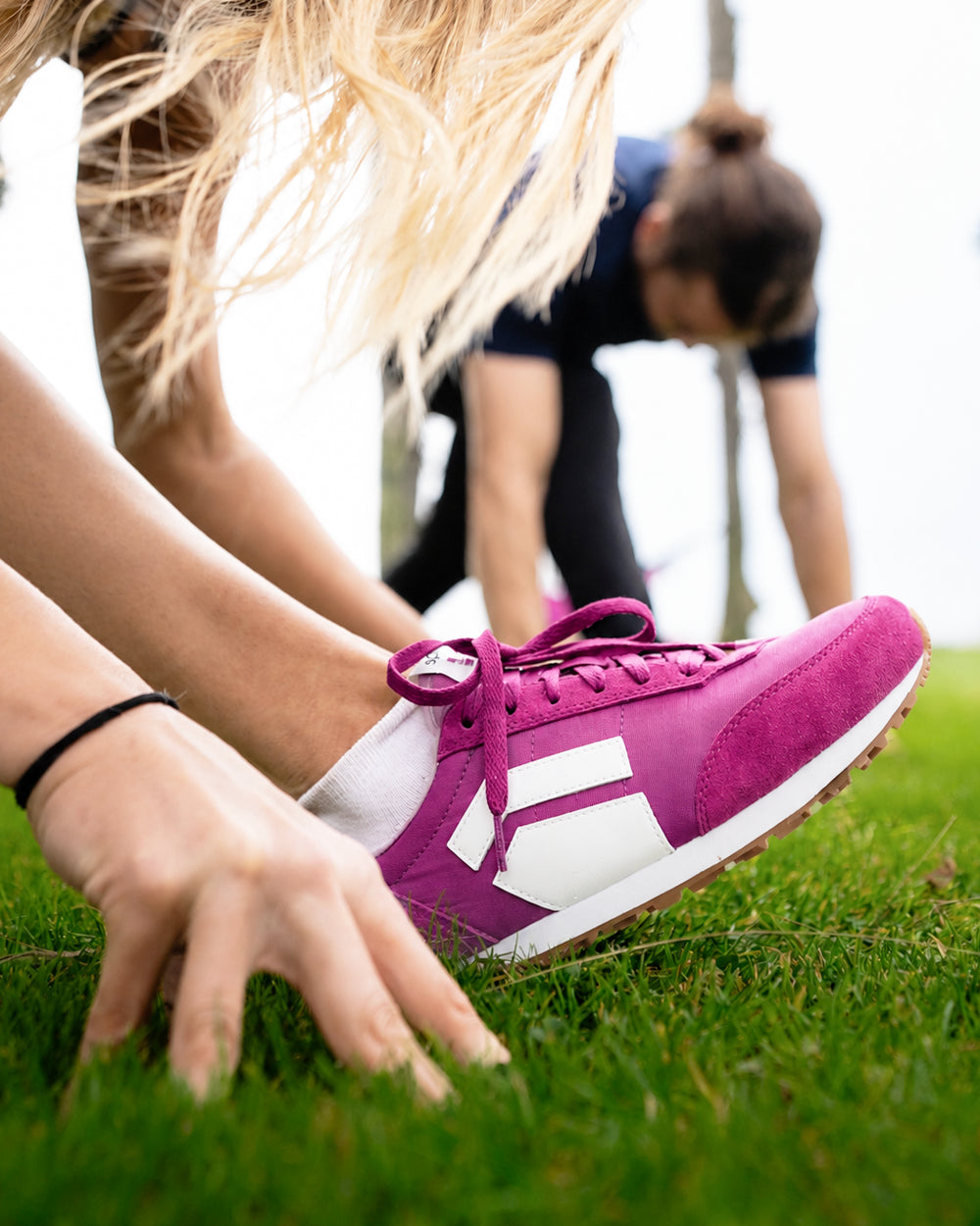 Splay Runner V1 Podium Pink '26 barefoot shoes — retro nylon-and-suede running shoe, lifestyle photo, the shoes shown in use outdoors