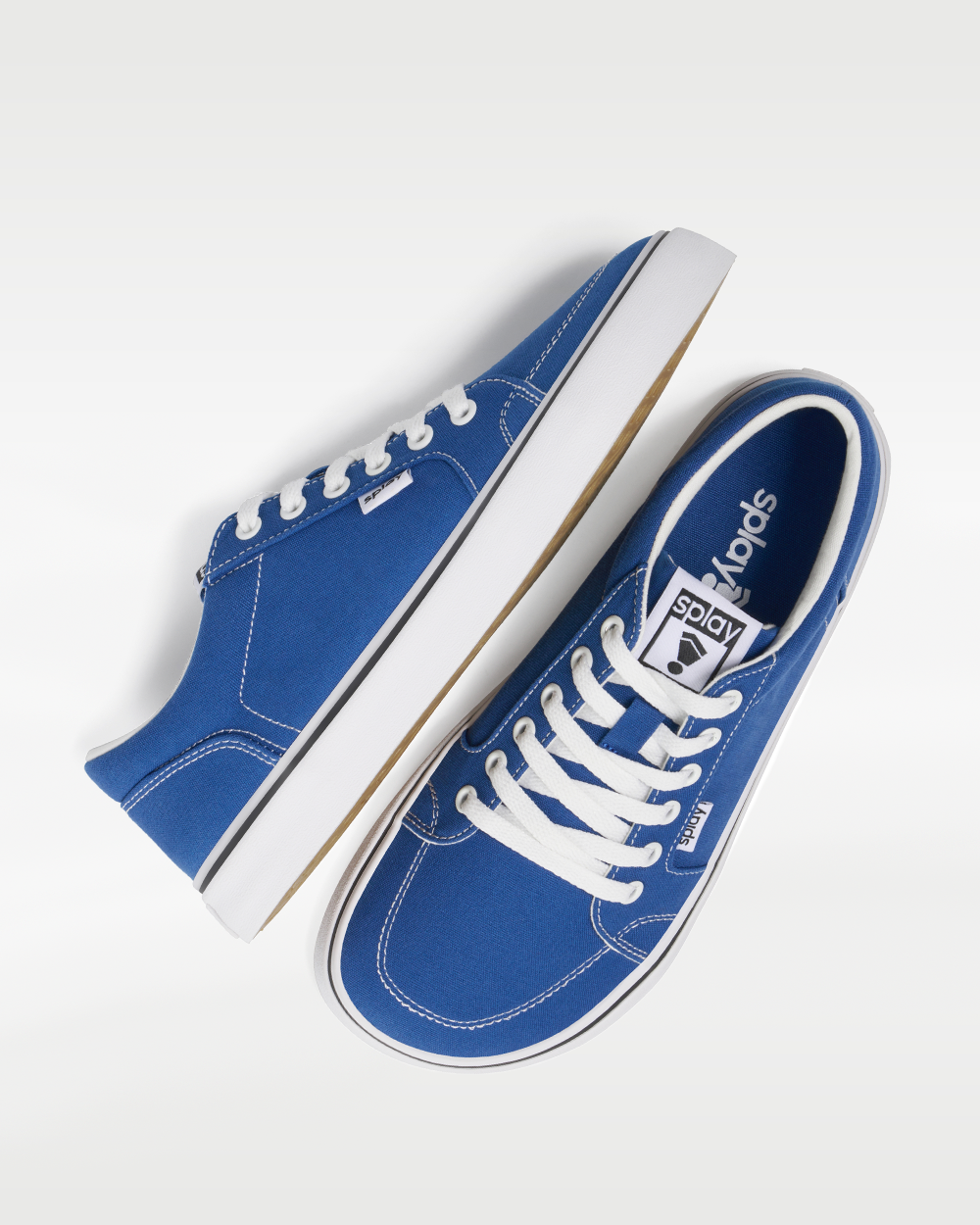 Splay REV LT Canvas San Juan barefoot shoes — low-top skate shoe, pair shot from above, one shoe tipped up to show the insole