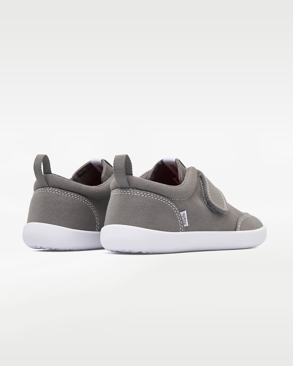 Splay Explore Kids Stone barefoot shoes — kids' low-top shoe with a hook-and-loop strap, pair viewed from behind, heels toward the camera