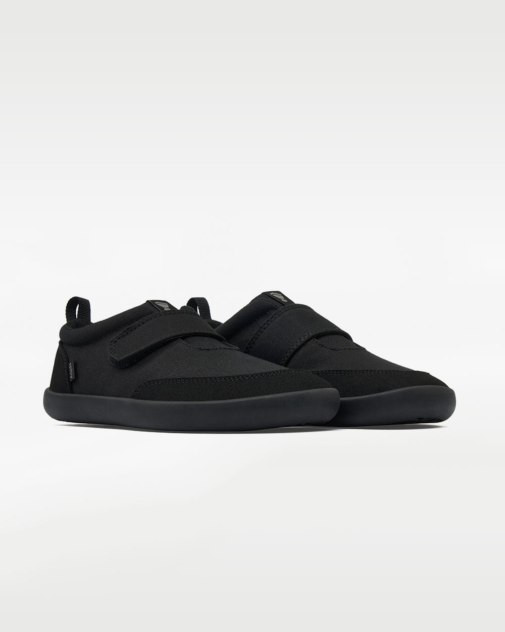 Splay Explore Wild Kids Jet barefoot shoes — kids' low-top shoe with a hook-and-loop strap, pair in an angled three-quarter view from the front