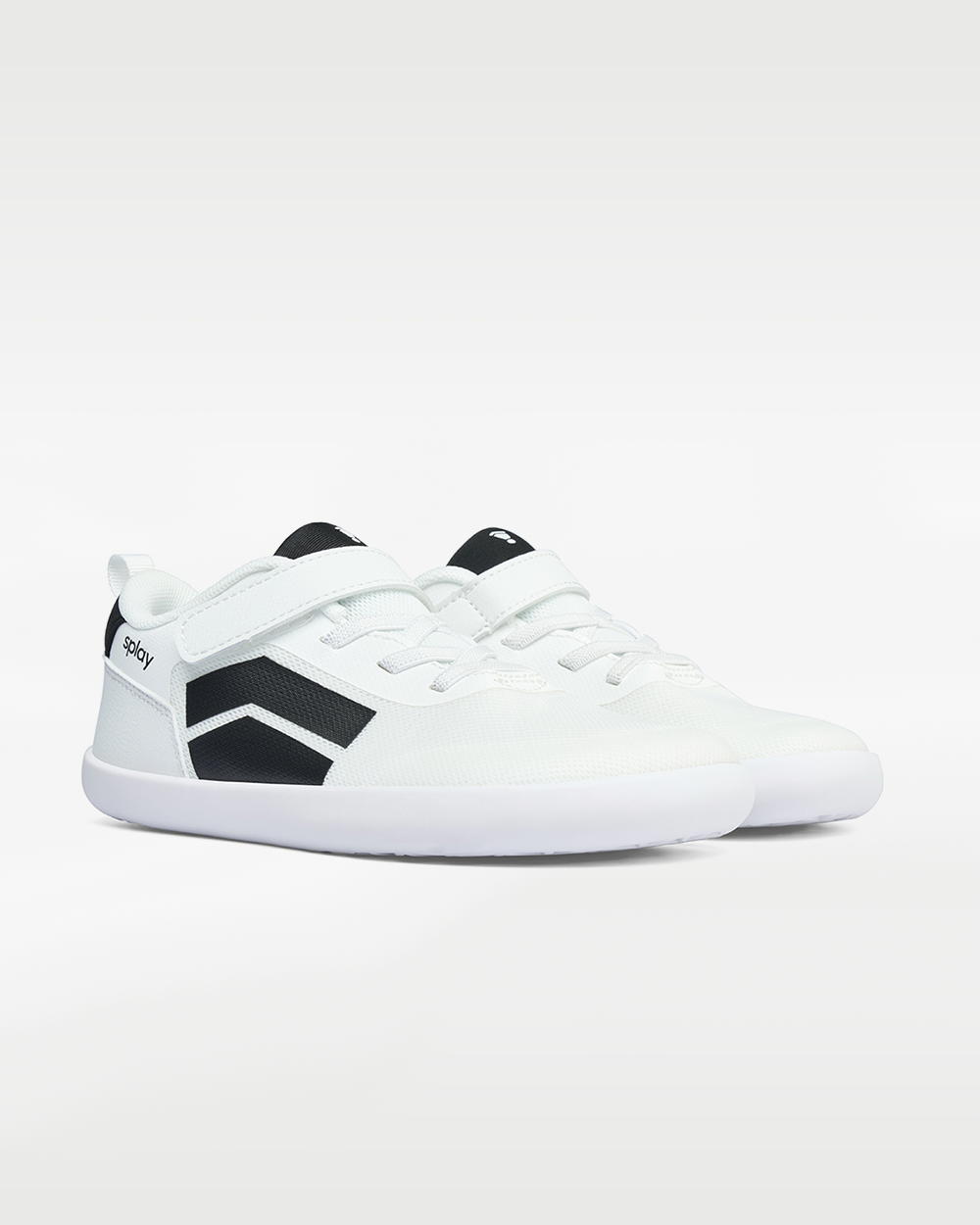 Splay Dash Kids Spark White barefoot shoes — kids' low-top sneaker with a strap and laces, pair in an angled three-quarter view from the front