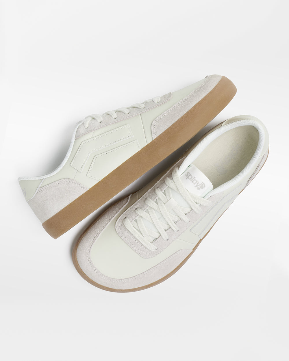 Splay 101 Whiteboard '26 barefoot shoes — low-top court sneaker with a side stripe and gum sole, pair shot from above, one shoe tipped up to show the insole